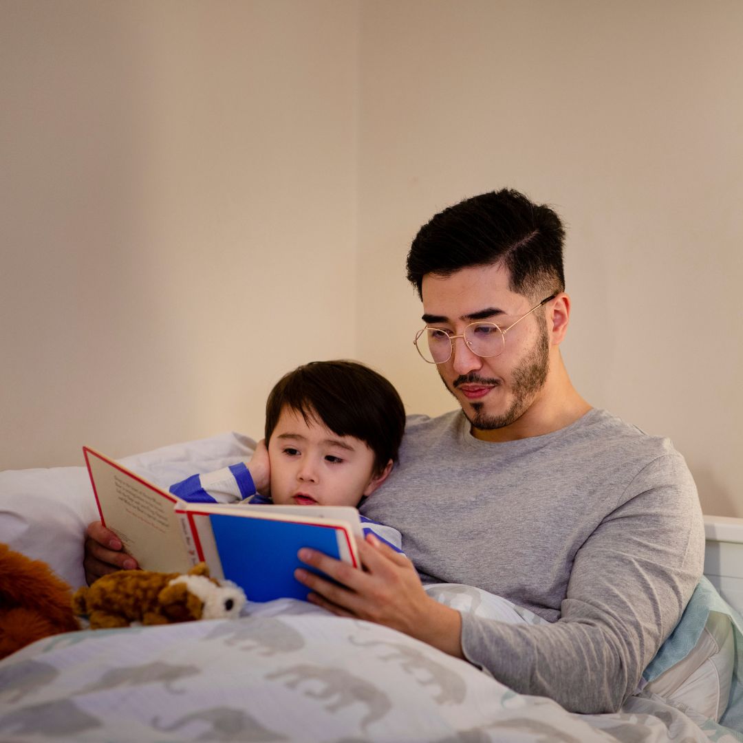 a parent reading to a child at bedtime