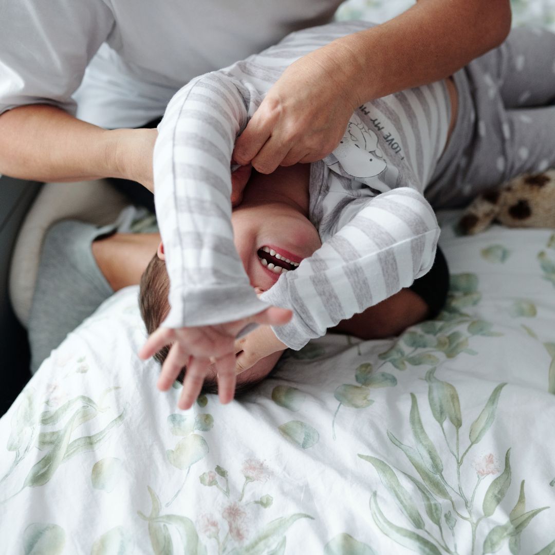 child crying on bed