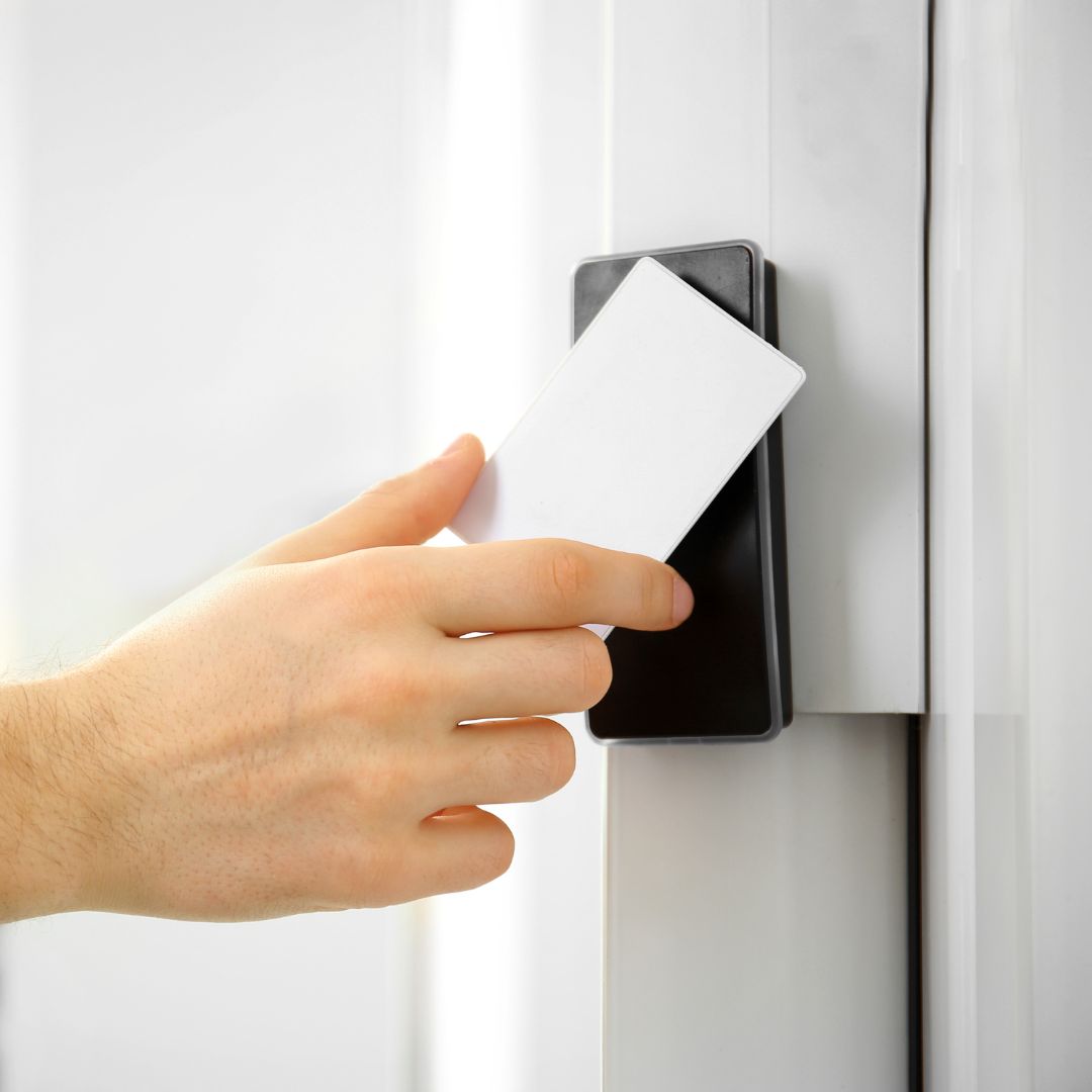 a person using a key card on a door